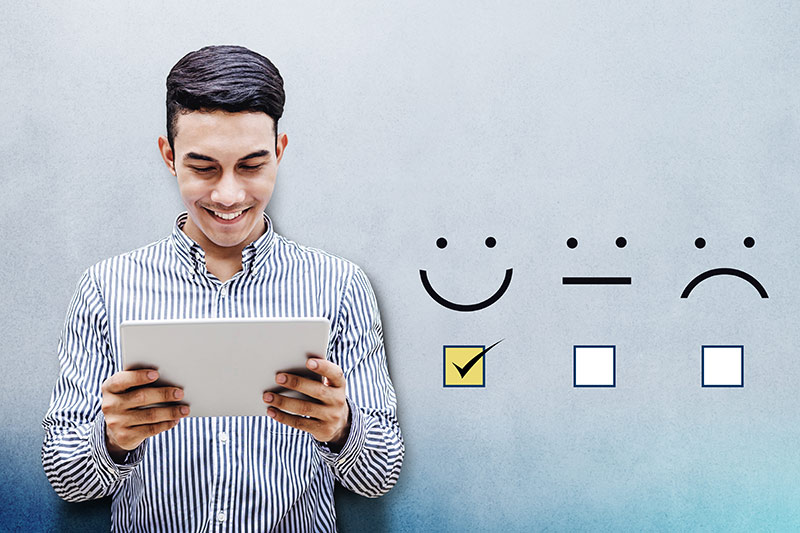 customer experience happy businessman holding tablet